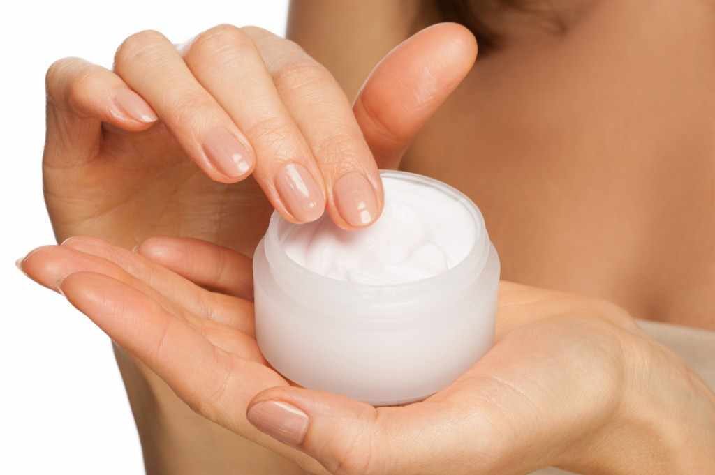 Womans-hands-holding-jar-of-skin-care-moisturizer-cream-1024x681